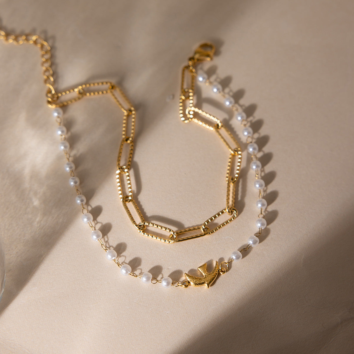 Jingqiao Sweet Style 18K gold stainless steel Flying Bird series pearl jewelry bracelet, light luxury high-end cross-border accessory