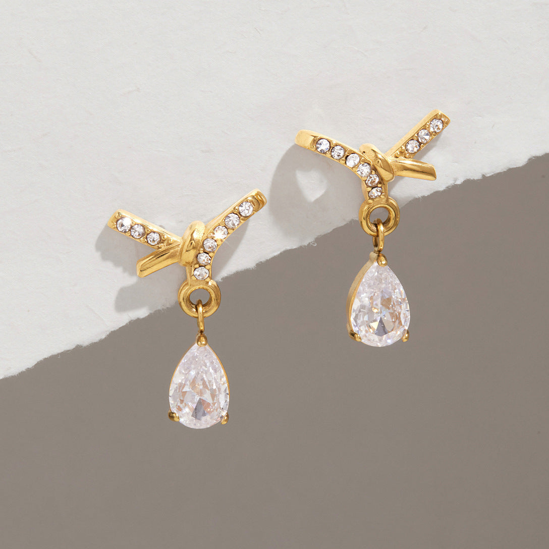 Jingqiao stainless steel earrings, rhinestone bows, teardrop-shaped zircon pendants, titanium steel cross-border accessories that do not fade