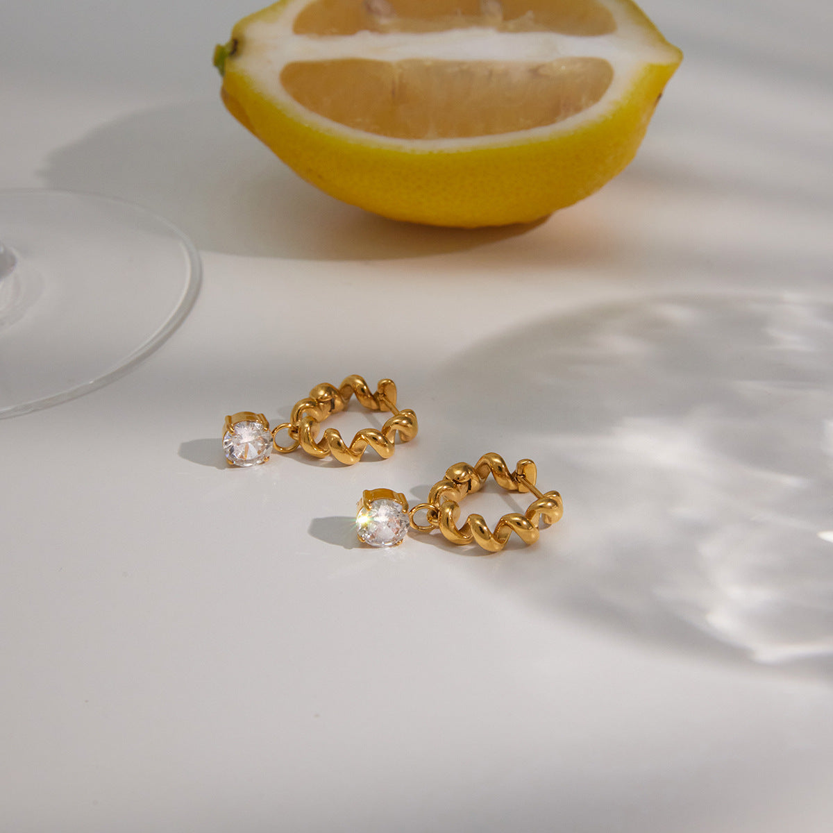 Jingqiao stainless steel earrings, seaside vacation style earrings, light luxury high-end zircon studs, titanium steel cross-border accessories for women